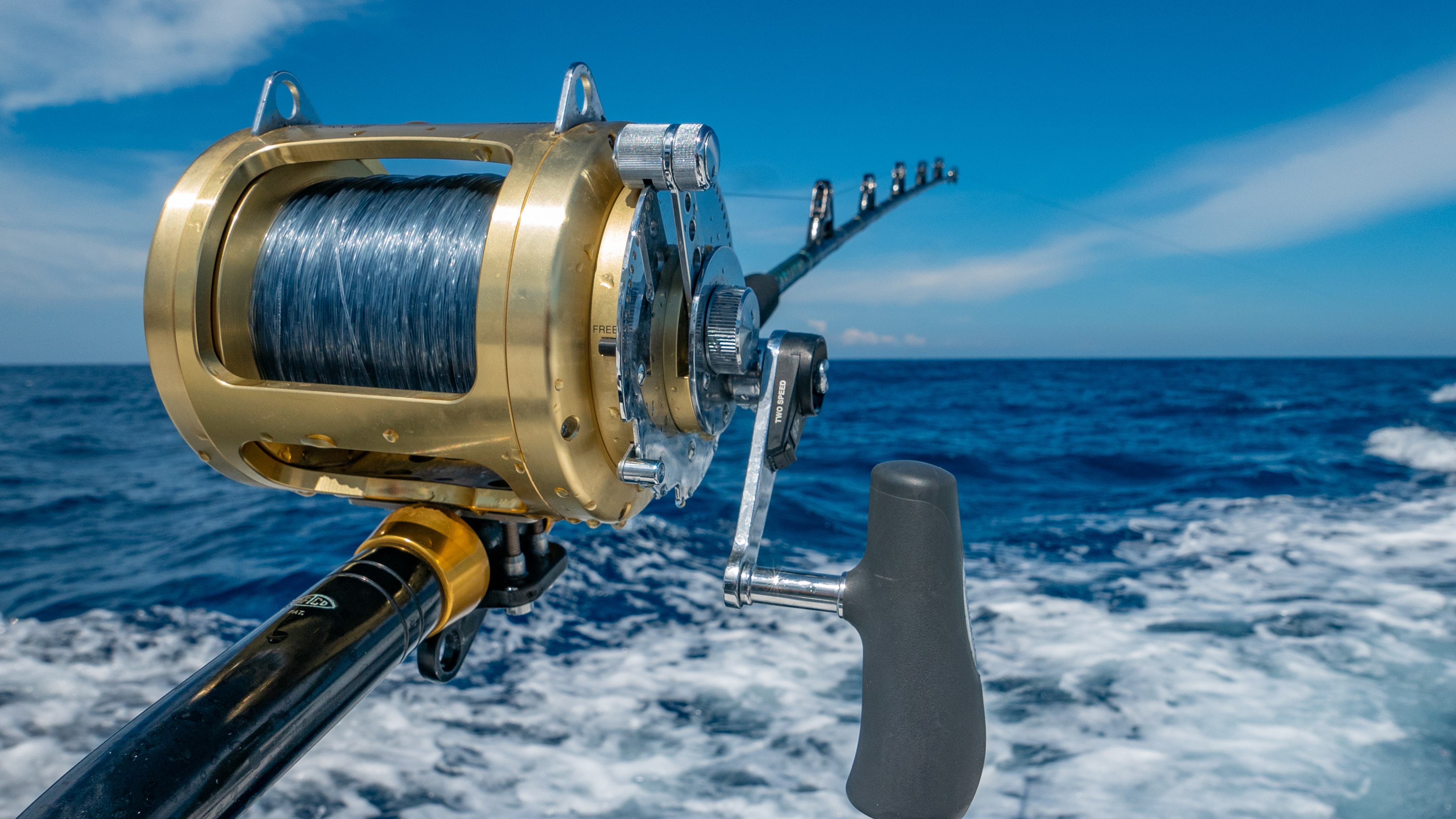 Fishing reel over blue ocean